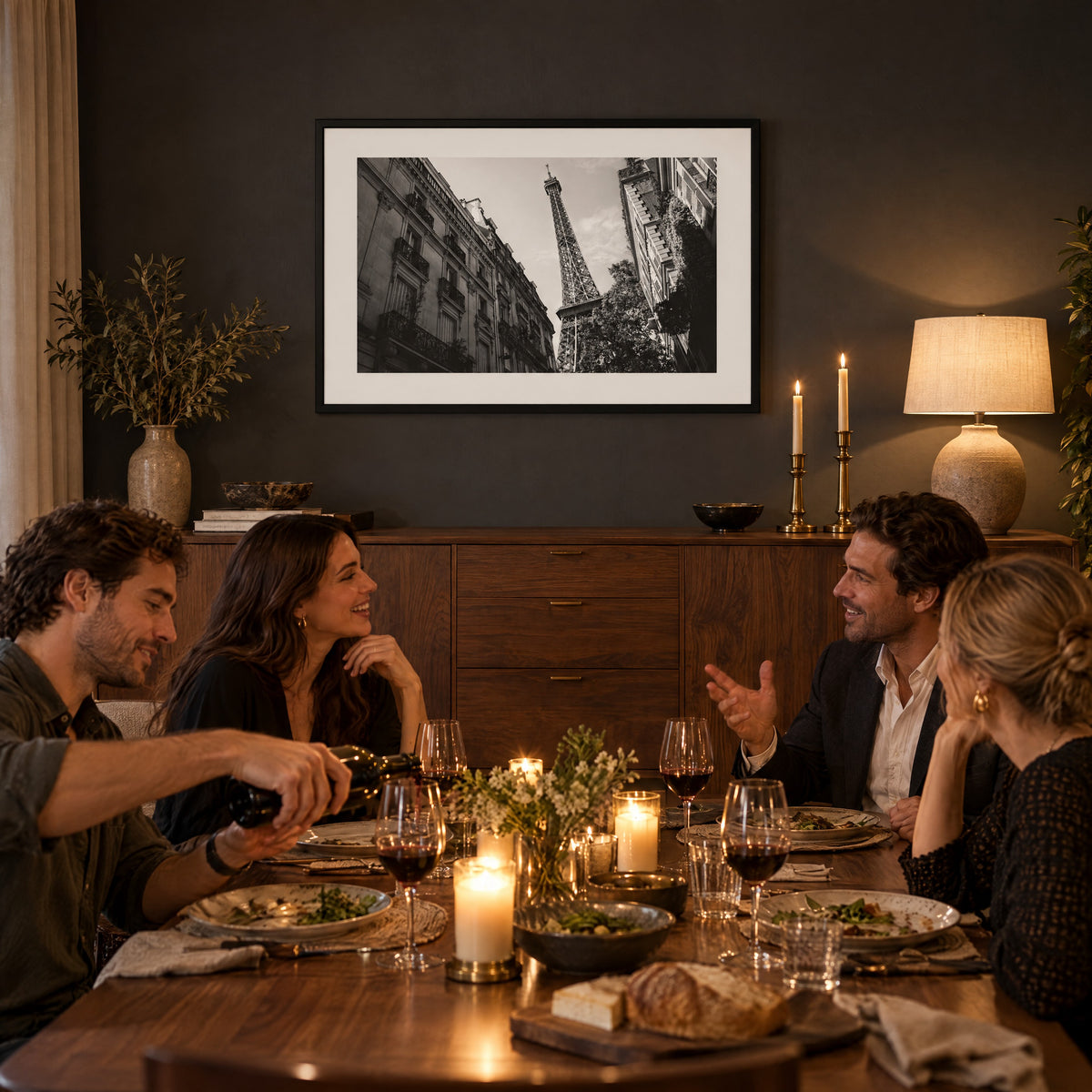 La Dame de Fer framed print above a walnut sideboard at a candlelit dinner