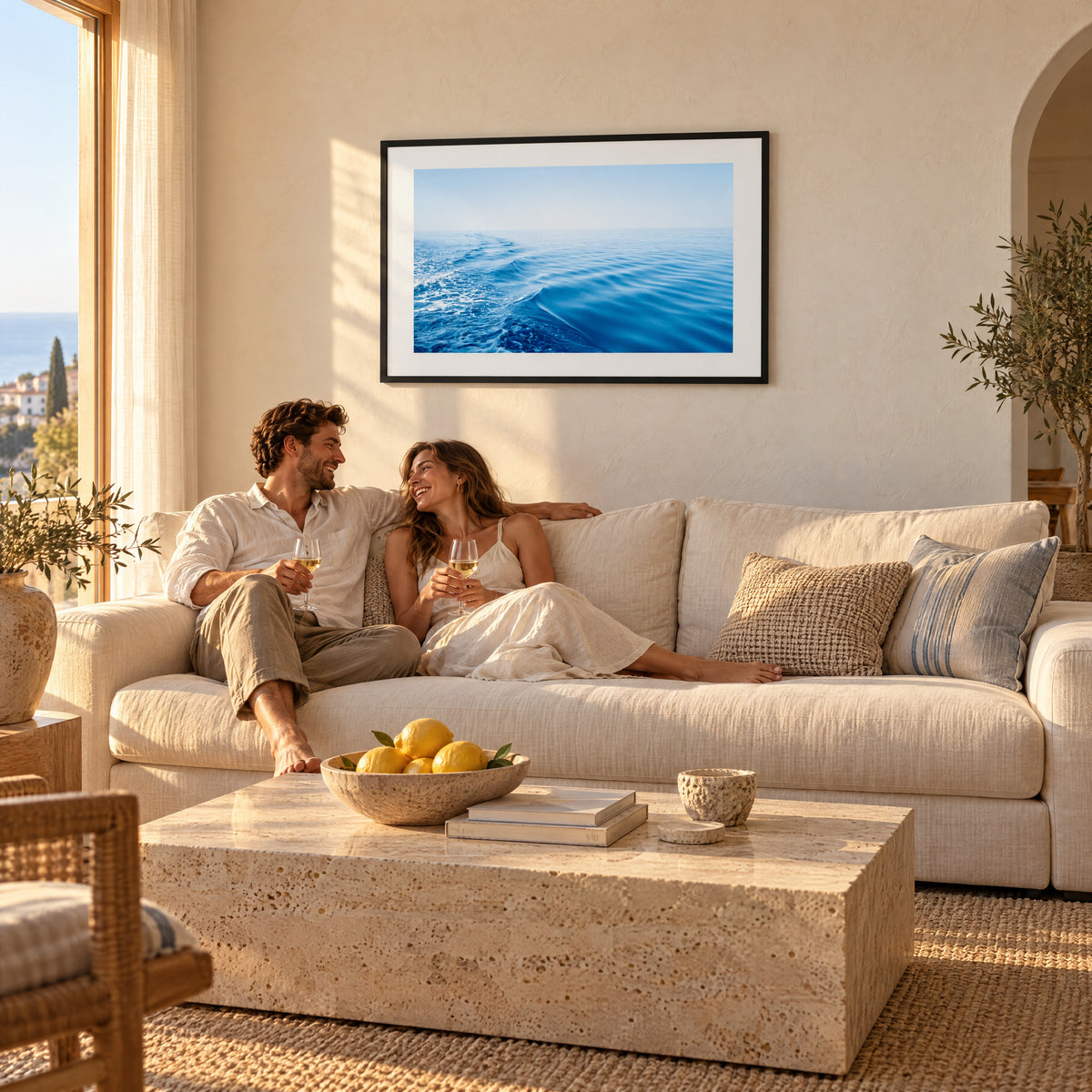 Silky Blue framed print above a linen sofa in a sunlit Mediterranean living room